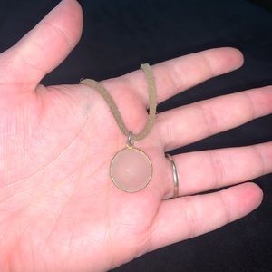 Leather choker with a moonstone looking charm.